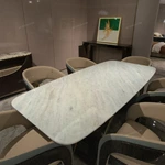 Rounded Rectangular Marble Dining Table with Woven Leather Arched Base and Metal Trim